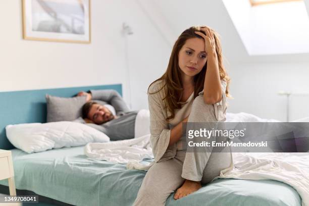 upset woman thinking about relationship problems and lover indifference - negative emotion stockfoto's en -beelden