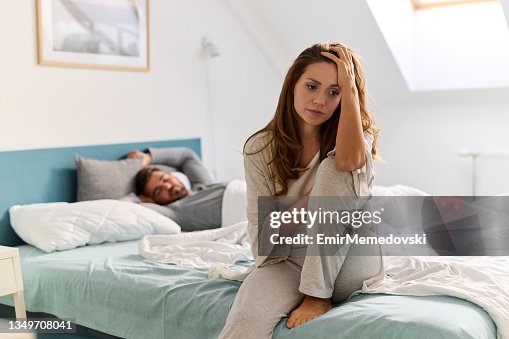 Upset woman thinking about relationship problems and lover indifference Upset woman thinking about relationship problems and lover indifference