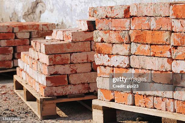 old piles of bricks at a construction site - recycling bildbanksfoton och bilder