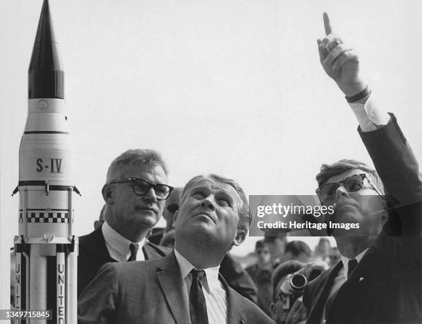 Seamans, von Braun and President Kennedy at Cape Canaveral, Florida, USA, 1963. Dr. Wernher von Braun explains the Saturn Launch System to President...