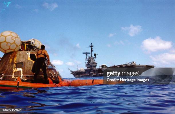 Apollo 17 recovery operations, Pacific Ocean, December 19, 1972. A water-level view of the Apollo 17 Command Module "America" floating in the sea...