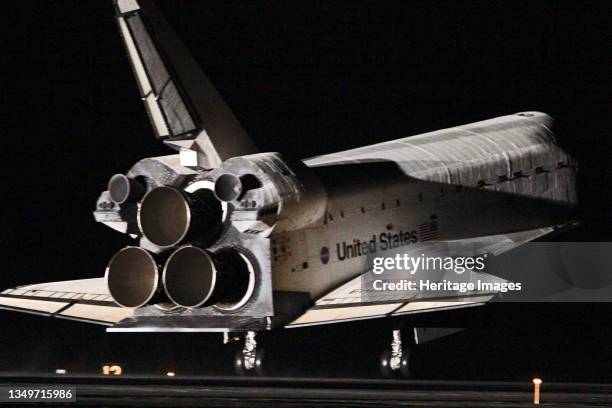 Space Shuttle Endeavour night landing, Florida. USA, February 21, 2010. Endeavour lands on Runway 15 at the Shuttle Landing Facility, Kennedy Space...