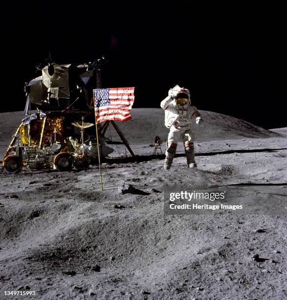 John Young on the lunar surface, 1972. Astronaut John W. Young, commander of the Apollo 16 lunar landing mission, jumps up from the lunar surface as...