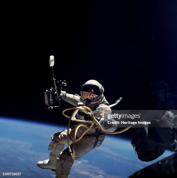 Ed White performs first U.S. Spacewalk, 1965. Astronaut Edward H. White II, pilot for the Gemini-Titan 4 space flight, floats in space during...