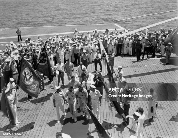 Gemini IV crew arrives on the USS Wasp, June 7, 1965. Astronauts Edward H. White II and James A. McDivitt on the flight deck of the aircraft carrier...