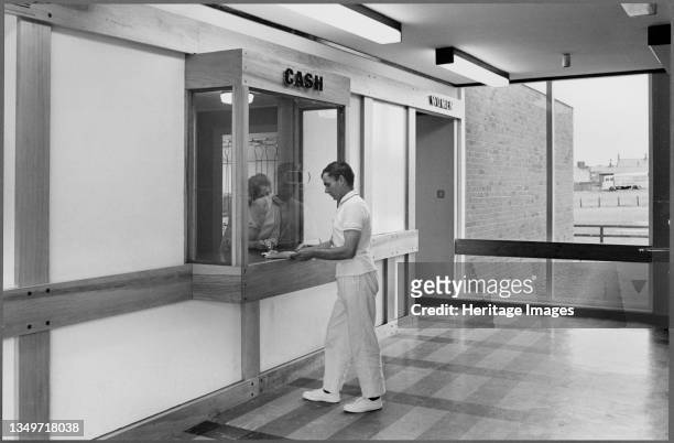 Blyth Swimming Pool, Blyth, Northumberland, 1960-1980. A cash counter and admission kiosk, with a doorway headed "Women" to the right, possibly in...
