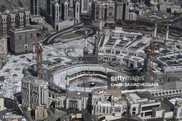 This aerial view shows the Saudi holy city of Mecca's Grand Mosque and its clock tower with the Kaaba , Islam's holiest site in the centre during the...
