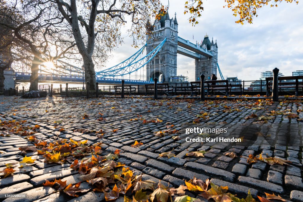 A sunrise view autumn leaves at London's Tower Bridge - stock photo