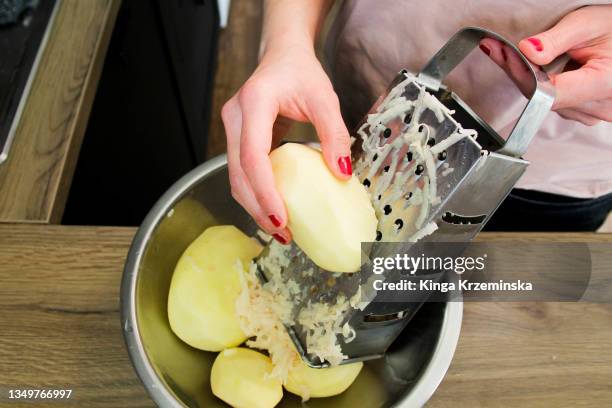 grated potatoes - grattugia foto e immagini stock