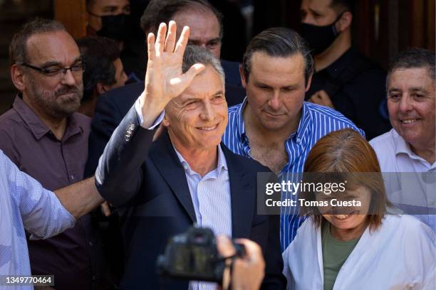 Former President of Argentina Mauricio Macri waves as he leaves Dolores federal court with Mayor of Dolores Camilo Etchevarren and Former Minister of...