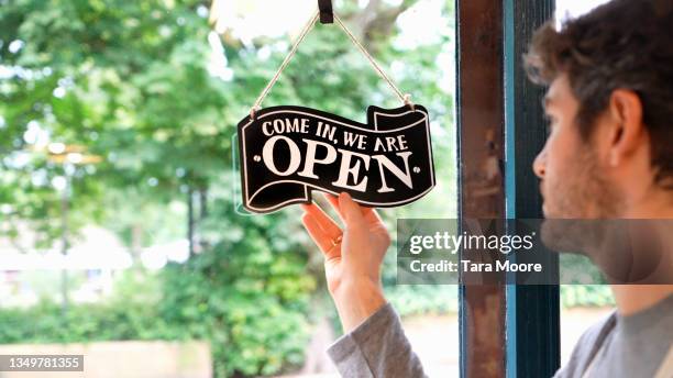 Open Manually Sign Man Open Sign Photos and Premium High Res Pictures - Getty Images