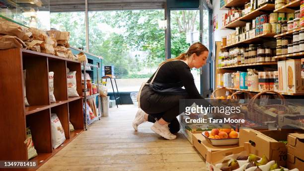 shopkeeper in grocery shop - greengrocer stock pictures, royalty-free photos & images