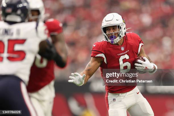 Running back James Conner of the Arizona Cardinals rushes the football against the Houston Texans during the NFL game at State Farm Stadium on...