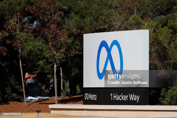 Sign with a new logo and the name 'Meta' is displayed in front of Facebook headquarters on October 28, 2021 in Menlo Park, California. A new name and...