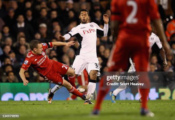 Jay Spearing of Liverpool tackles Mousa Dembele of Fulham leading to his red card during the Barclays Premier League match between Fulham and...