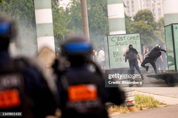 Demonstrators clash with police after a march protesting the shooting of Nahel by a police officer in the Nanterre suburb of Paris, France, on...