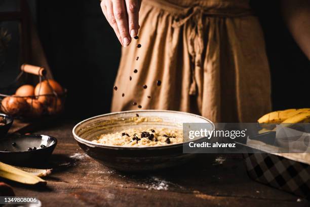 baking banana bread at home kitchen - chocolate chips stock pictures, royalty-free photos & images