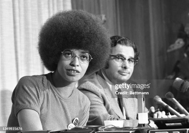 Angela Davis tells reporters that she may go to court to challenge the right of the University of California Regents to hire or fire her from her...