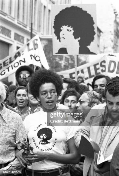 Thousands of young people here turned out for a demonstration called by the Communist Youth Movement to protest murder trial and voice their support...