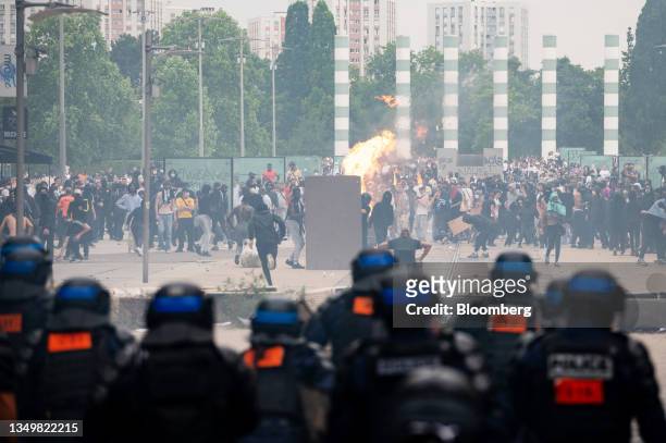 Demonstrators clash with police after a march protesting the shooting of Nahel by a police officer in the Nanterre suburb of Paris, France, on...