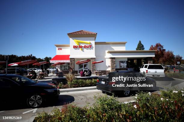 Cars line up in the drive thru at an In-n-Out restaurant on October 28, 2021 in Pleasant Hill, California. Contra Costa county health officials shut...
