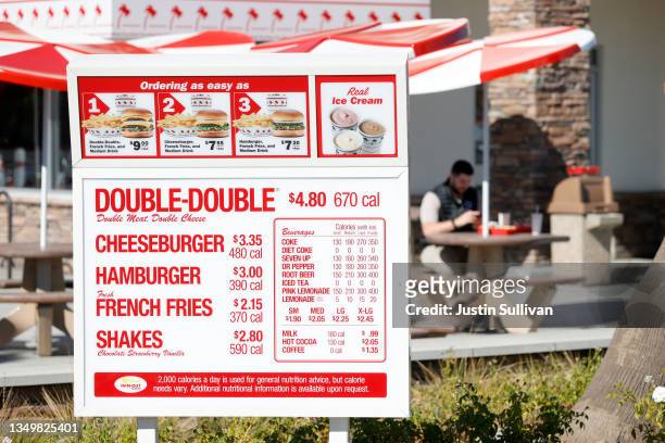 Menu is displayed in the drive thru at an In-n-Out restaurant on October 28, 2021 in Pleasant Hill, California. Contra Costa county health officials...