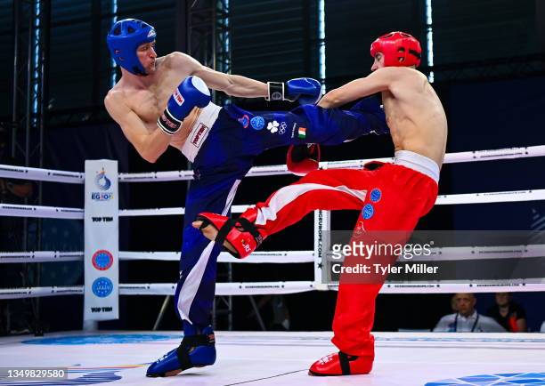 Myslenice , Poland - 30 June 2023; Eoin Glynn of Ireland, left, in action against Oskar Sobanski of Poland in their Kickboxing Men's Full Contact...