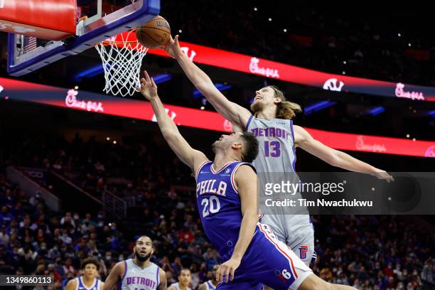Kelly Olynyk of the Detroit Pistons blocks Georges Niang of the Philadelphia 76ers during the second quarter at Wells Fargo Center on October 28,...