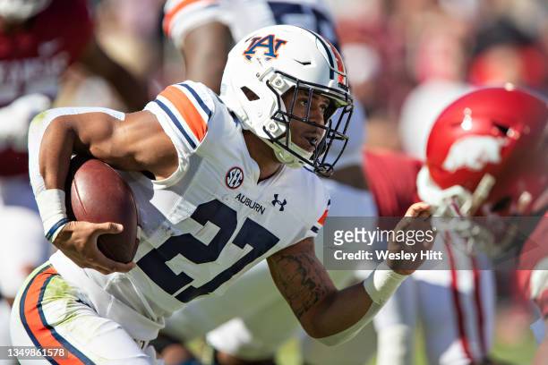 Jarquez Hunter of the Auburn Tigers runs the ball during a game against the Arkansas Razorbacks at Donald W. Reynolds Stadium on October 16, 2021 in...