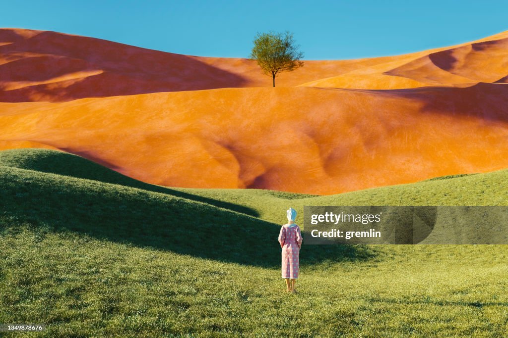 Surreal landscape with woman in bathrobe