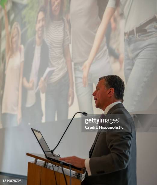 professor giving a commencement speech in a graduation ceremony - graduation speech stock pictures, royalty-free photos & images