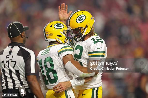 Randall Cobb of the Green Bay Packers is congratulated by Aaron Rodgers following a touchdown during the second half of a game against the Arizona...