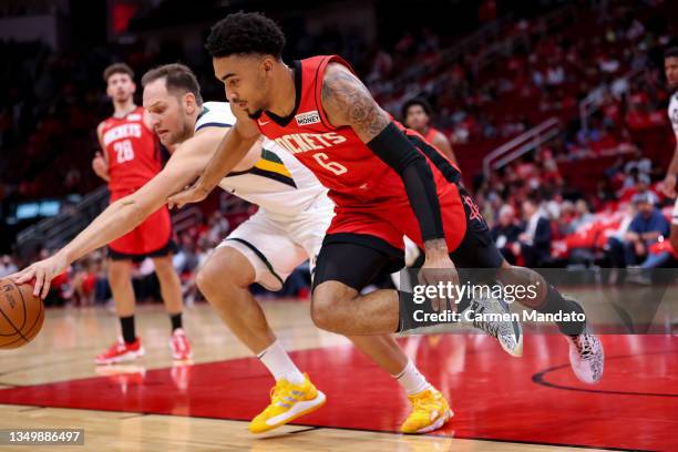 Bojan Bogdanovic of the Utah Jazz and Kenyon Martin Jr. #6 of the Houston Rockets reach for a loose ball during the second second half at Toyota...