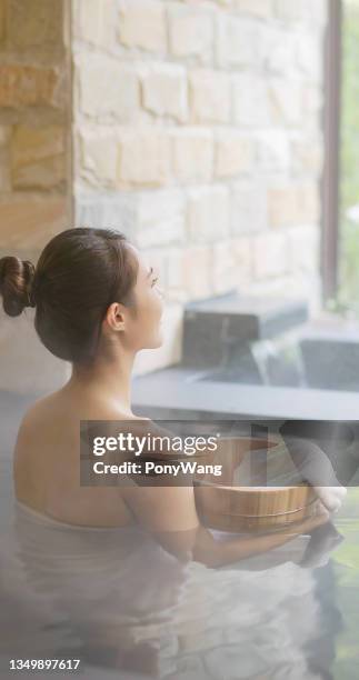 woman in hot spring relax - japanese women bath stock pictures, royalty-free photos & images