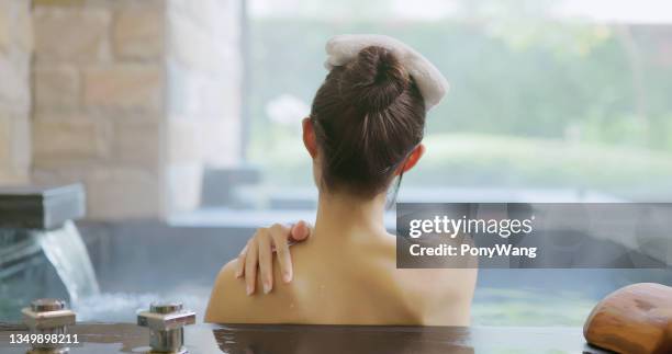 woman relax in hot spring - japanese women bath stock pictures, royalty-free photos & images