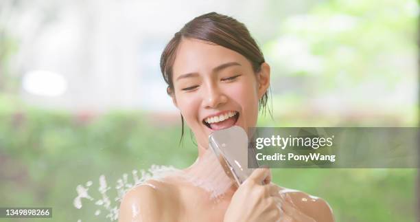 beauty woman is taking shower - asian woman wet hair stock pictures, royalty-free photos & images