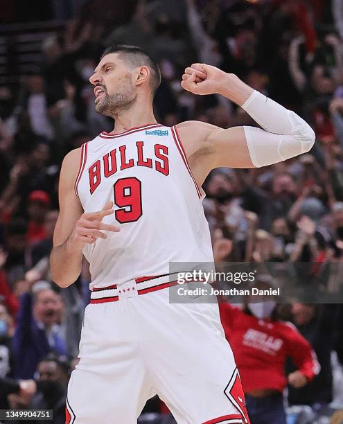 Nikola Vucevic of the Chicago Bulls reacts after hitting a three point shot late in the game against the New York Knicks at the United Center on...