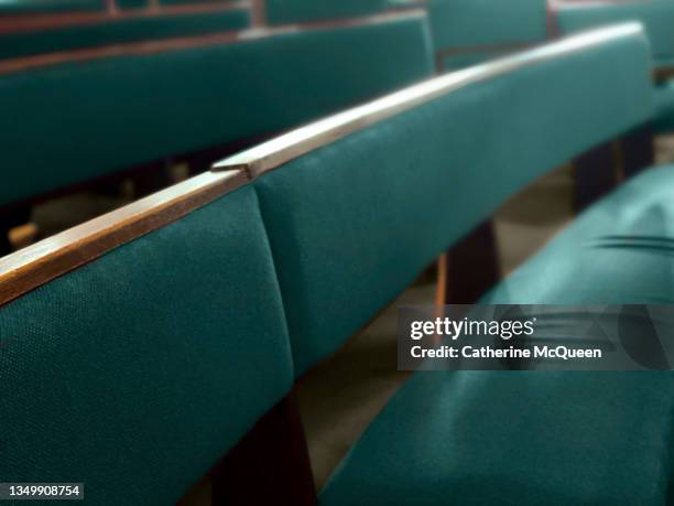 empty seats in rows of pews - funeral ceremony stock pictures, royalty-free photos & images