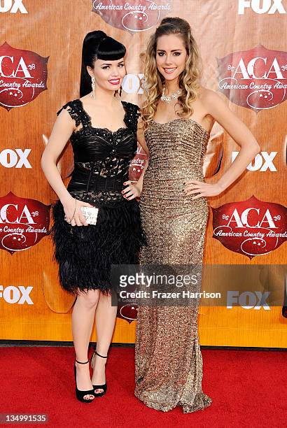 Recording artists Susie Brown and Danelle Leverett of The JaneDear Girls arrive at the American Country Awards 2011 at the MGM Grand Garden Arena on...
