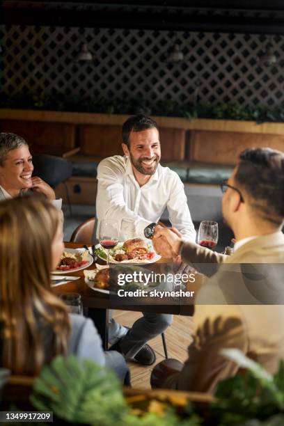 successful deal on a business lunch! - victory dinner stockfoto's en -beelden