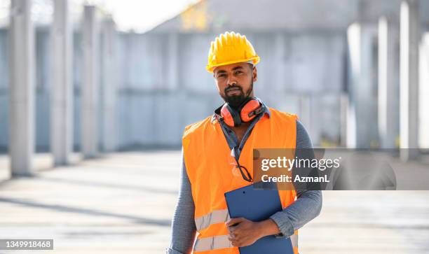 portrait of construction foreman standing onsite - waistcoat stock pictures, royalty-free photos & images