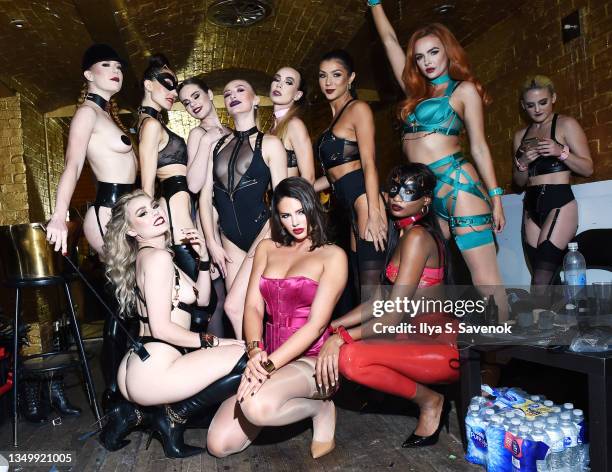 Models, including Tiah Eckhardt and Zita Vass , pose backstage in Honey Birdette lingerie as Honey Birdette celebrates Halloween at Bartschland on...