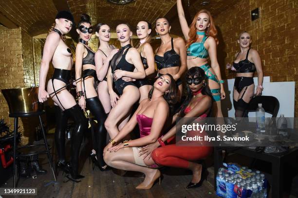 Models, including Tiah Eckhardt and Zita Vass , pose backstage in Honey Birdette lingerie as Honey Birdette celebrates Halloween at Bartschland on...