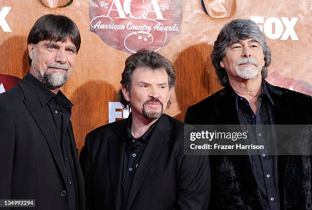 Musicians Teddy Gentry, Jeff Cook and Randy Owen of music group Alabama arrives at the American Country Awards 2011 at the MGM Grand Garden Arena on...