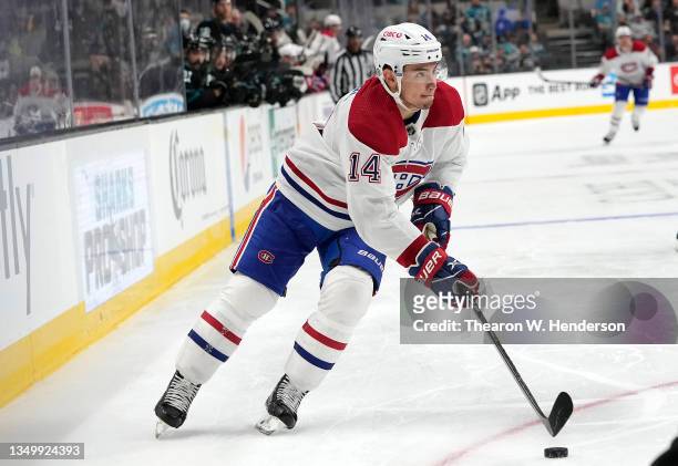 Nick Suzuki of the Montreal Canadiens skates with control of the puck against the San Jose Sharks during the third period at SAP Center on October...
