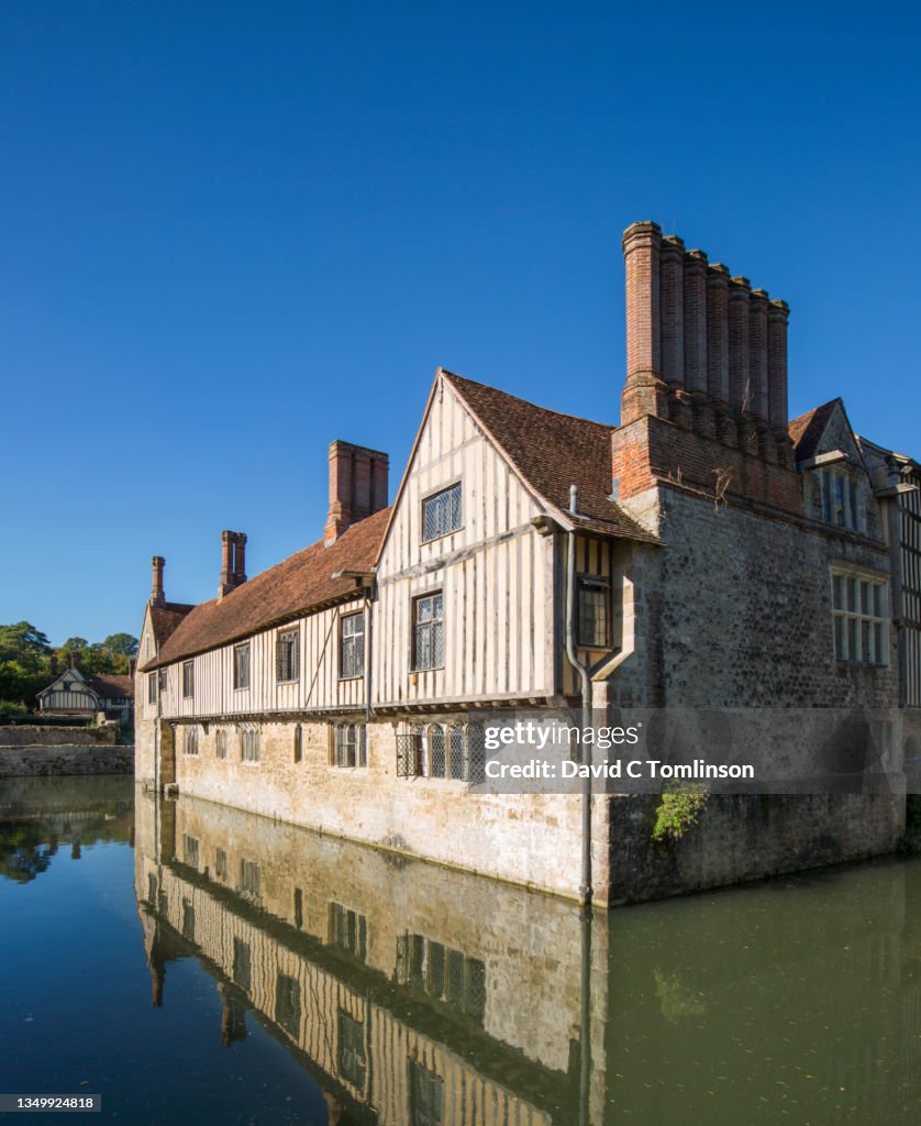 Ightham Mote A Historic Medieval Manor House Reflected In The Still ightham-mote-a-historic-medieval-manor-house-reflected-in-the-still