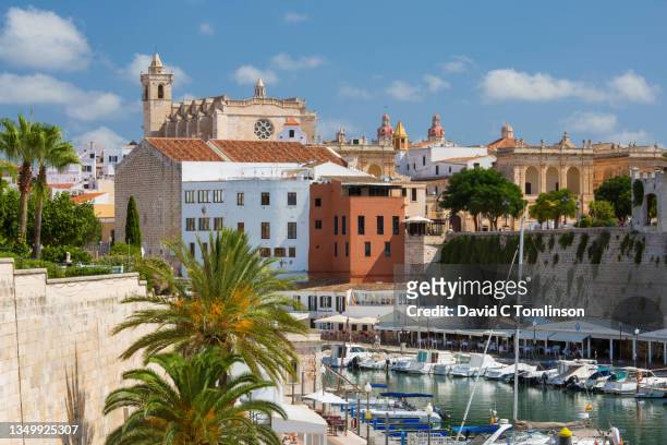 view over tranquil harbour to the old town skyline, 14th century cathedral prominent, ciutadella de menorca, menorca, balearic islands, spain - ciutadella stock pictures, royalty-free photos & images