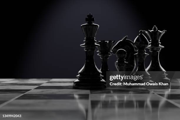chess pieces on a chessboard - norway chess stock pictures, royalty-free photos & images