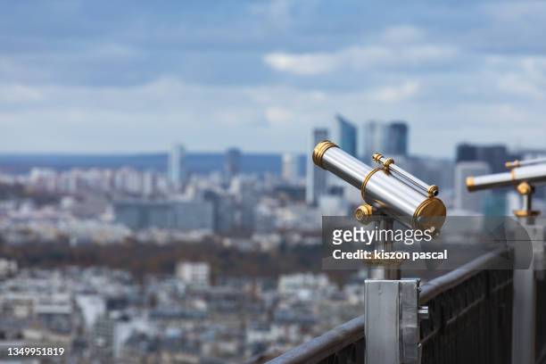 telescope with views of paris in observation point , france - viewfinder imagens e fotografias de stock