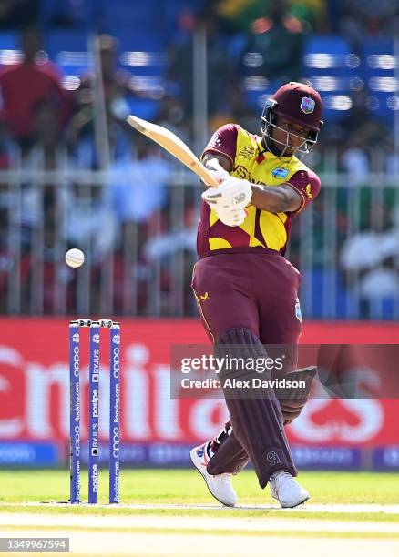 Evin Lewis of West Indies plays a shot during the ICC Men's T20 World Cup match between West Indies and Bangladesh at Sharjah Cricket Stadium on...